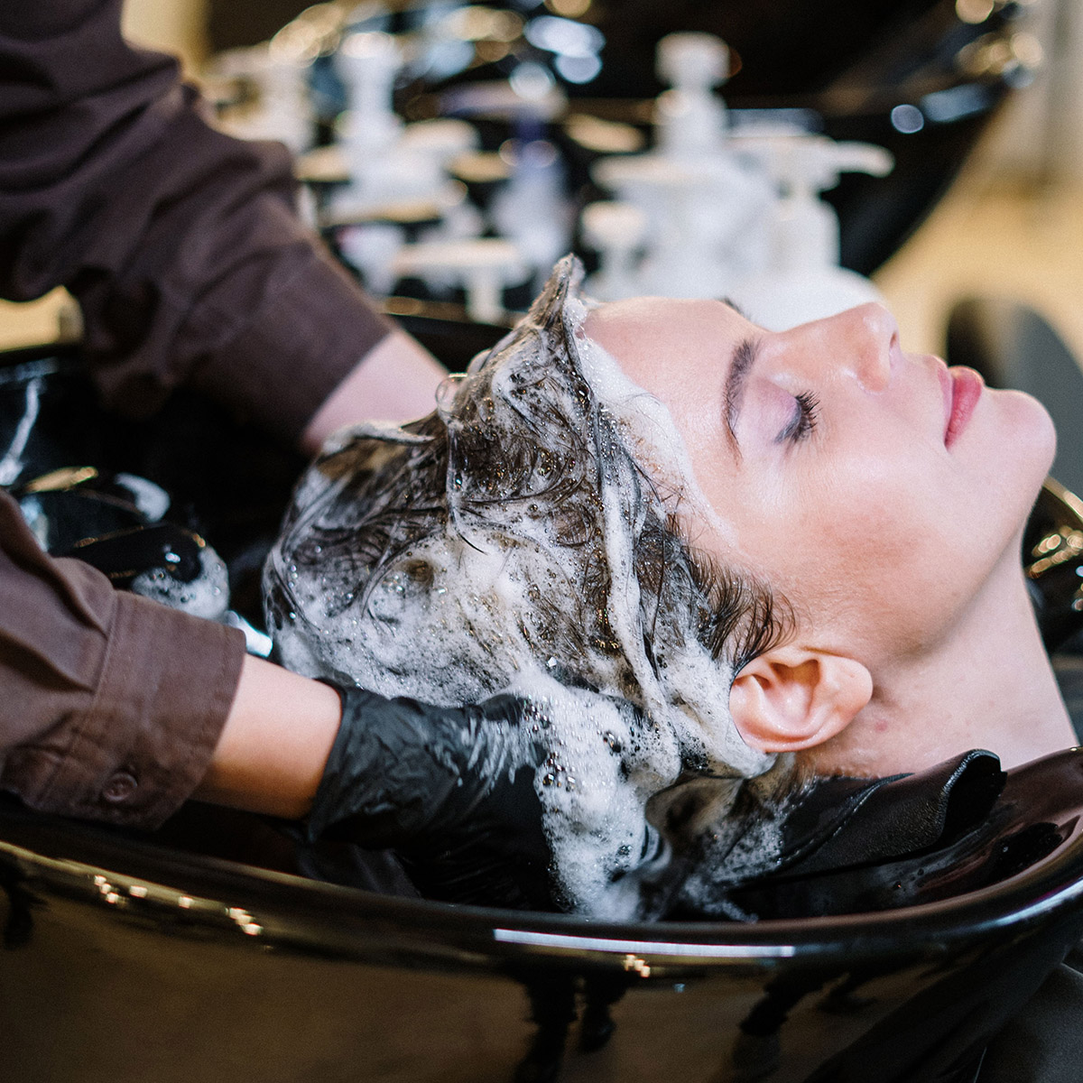 thsde-shampoo-bowl client's head in a shampoo bowl